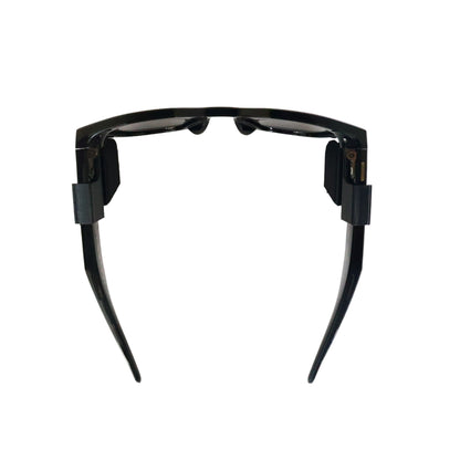 Black futuristic sunglasses on a white background
